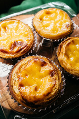 classic portuguese egg tarts with flaky crust and creamy custard filling
