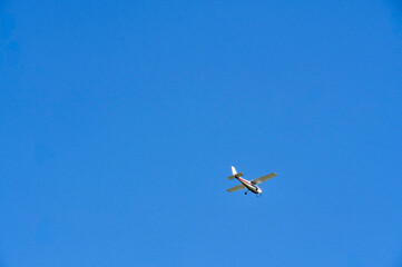 Small plane in the blue sky