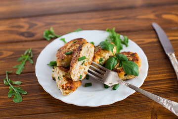 Chicken cutlets with a crispy crust on a wooden table