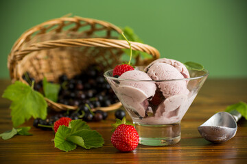 Homemade berry ice cream on green background