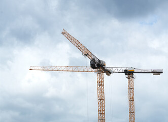 Construction cranes. Construction equipment on construction site.