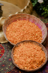 Baskets filled with vibrant orange flower petals, perfect for a festive event or ceremony. Symbolic...
