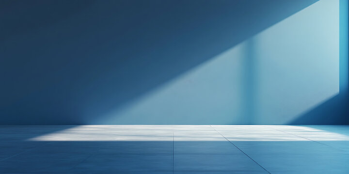 Modern interior with concrete floor and blue wall bathed in natural light creating minimalist and serene atmosphere ideal for background