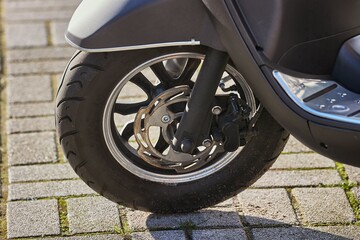 Scooter front wheel close up