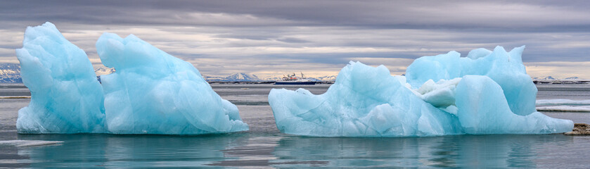 Blue icebergs floating in the Arctic