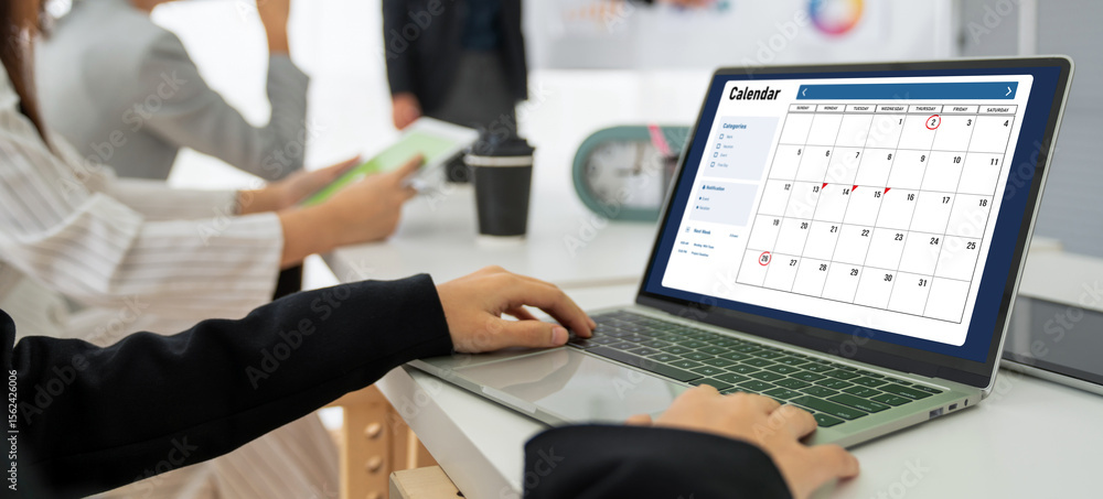 Poster calendar on computer software application for modish schedule planning for personal organizer and on