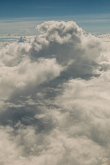Dramatic cloud formation above the horizon captured during a clear daylight flight