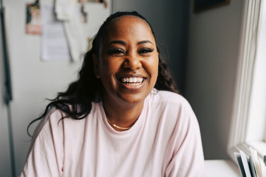 Portrait of happy woman with false eyelashes