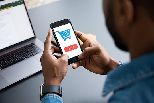 Man holding smartphone with shopping cart icon and buy button ready to purchase
