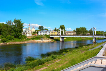 A view of the pedestrian bridge of the city of Torzhok on a sunny summer day. Summer landscape of the city of Torzhok.