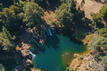 Obraz premium Breathtaking aerial view of Burney Falls cascading into a serene pool in Northern California, Aerial shot of Burney Falls in Northern California, USA