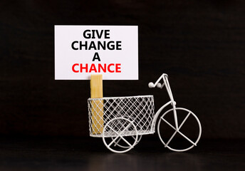 Give change a chance symbol. Concept words phrase Give change a chance on beautiful white paper on...