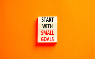 Start with small goals symbol. Concept words phrase Start with small goals on beautiful wooden...