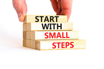 Start with small steps symbol. Concept words phrase Start with small steps on beautiful wooden...