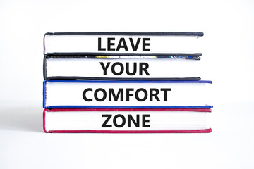 Leave your comfort zone symbol. Concept words Leave your comfort zone on beautiful books. Beautiful...