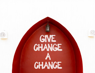 Give change a chance symbol. Concept words phrase Give change a chance on beautiful brown wall. Beautiful white wall background. Business Give change a chance concept. Copy space.