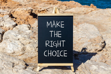 Make the right choice symbol. Concept words phrase Make the right choice on beautiful black blackboard. Beautiful stone blue sea sky background. Business Make the right choice concept. Copy space.