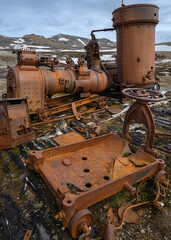 The ruins of equipment in Camp Mansfield (New London) in the Svalbard archipelago