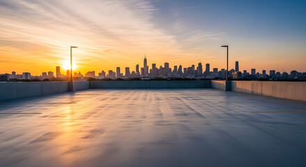 A city skyline silhouetted against a vibrant sunset, viewed from a rooftop.