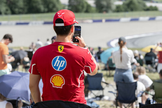 Spielberg, Austria: Formula 1 Ferrari fan in a red shirt and a red cap on the Red Bull Ring Race track during the Austrian Grand Prix