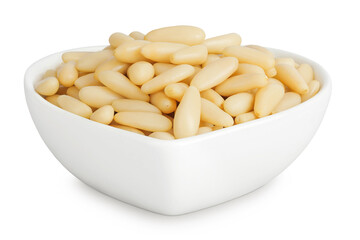 Shelled European pine nuts in ceramic bowl isolated on white background with full depth of field