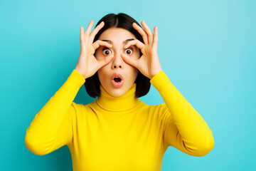 Funny Expression of Shocked Woman Isolated on Blue Wall