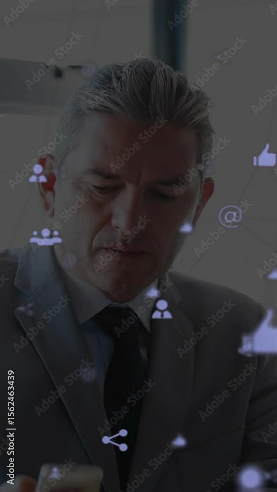 Poster animation of network of connections with icons over caucasian businessman using computer