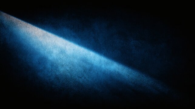 Diagonal beam of bright blue light illuminating a textured dark wall - Powered by Adobe