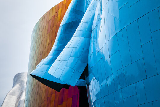 Museum of pop culture building exterior reflecting cloudy sky in seattle, washington, July 4, 2014