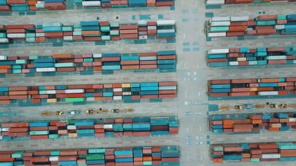 Aerial view of shipping containers in a port cargo terminal - Powered by Adobe