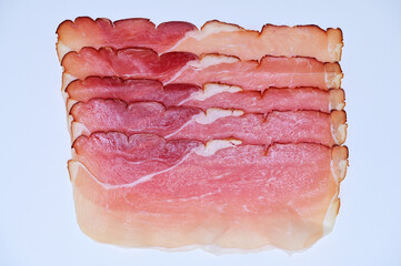 delicious slices of smoked ham isolated on white background