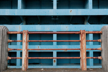 The bridge's massive steel main girders and the old rusty steel safety railing