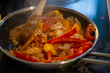 Macro Photo of Woman Cooking Chicken Sauté