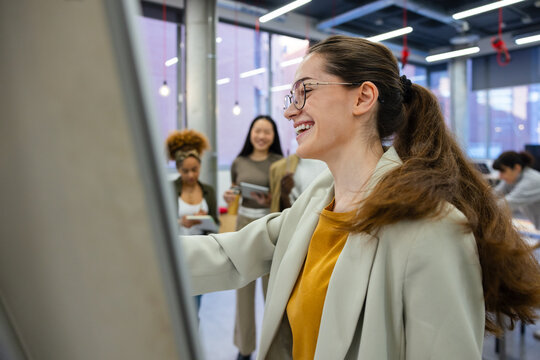 Gen-z team brainstorming session in modern office