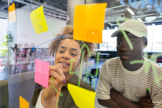 Creative team collaborating using colorful sticky notes