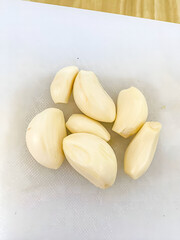 Peeled Garlic Cloves on a Cutting Board