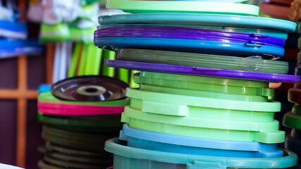 A collection of plastic buckets at a household goods store