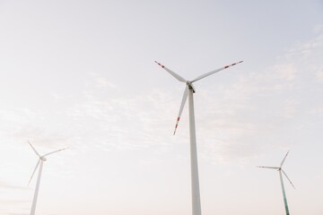 Wind turbines generating clean energy under a cloudy sky