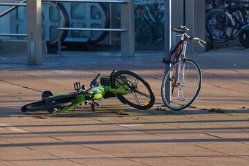 Bicycles on the streets of Rotterdam, one toppled