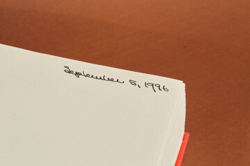 Book Page with Handwritten Date in Corner
