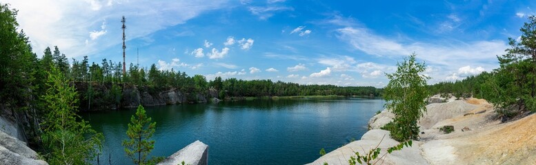 The abandoned Korostyshiv quarry, with its deep blue waters and rugged cliffs, has become a scenic spot for recreation, fishing, and swimming.