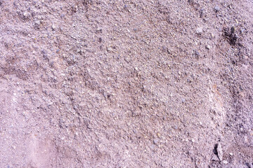 A close-up background of natural stone reveals mineral veins running through its textured surface.