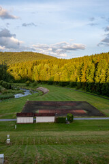 Abandoned tennis court in forest valley