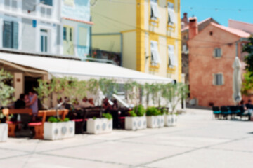 Blurred abstract background of outdoor cafe in Omisalj, Croatia