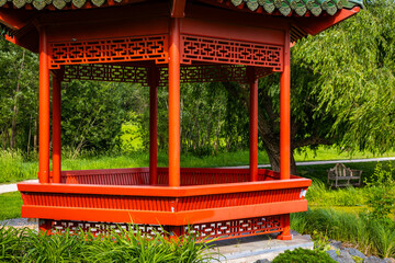 Beautiful chinese garden with red Gazebo on sunny day