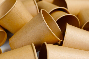 Brown paper cups on white background.