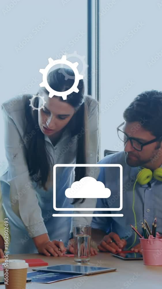 Aufkleber animation of multiple digital icons against diverse colleagues discussing together at office