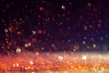 Sparkling particles create a mesmerizing visual effect in a dark setting