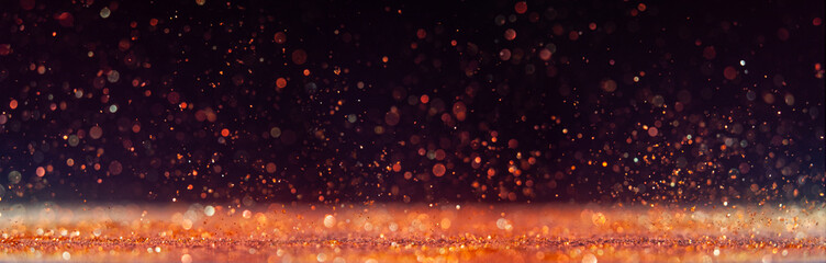 Sparkling particles create a dreamy atmosphere in a dark setting