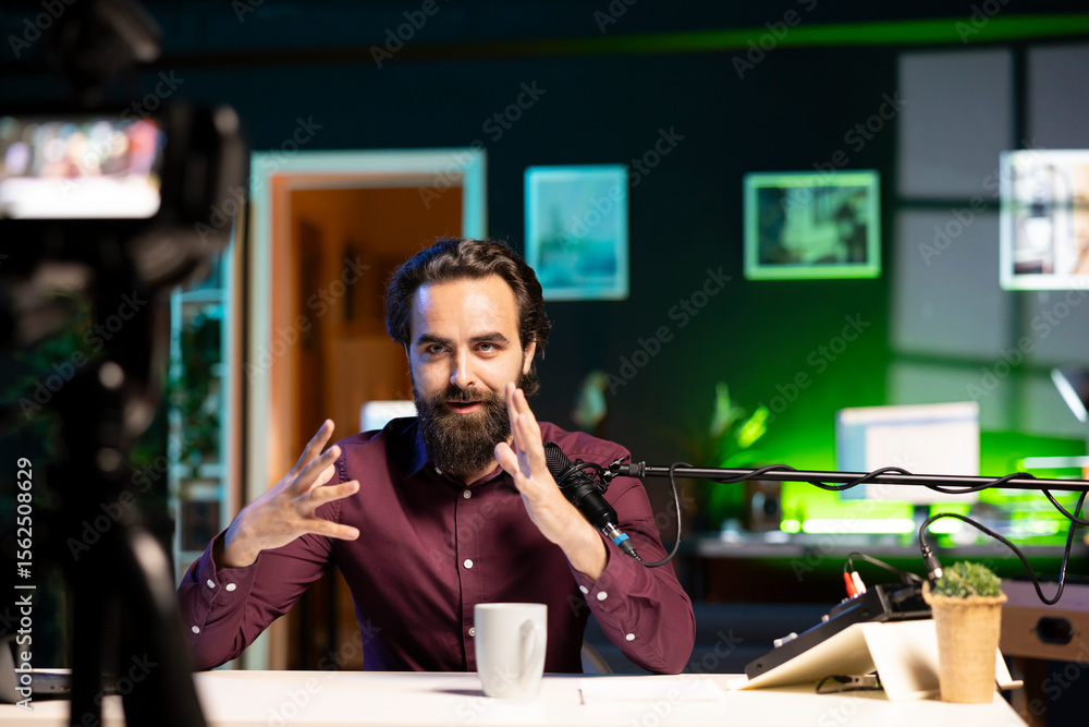 Poster online star talking in front on professional camera and quality mic in studio, discussing with viewe